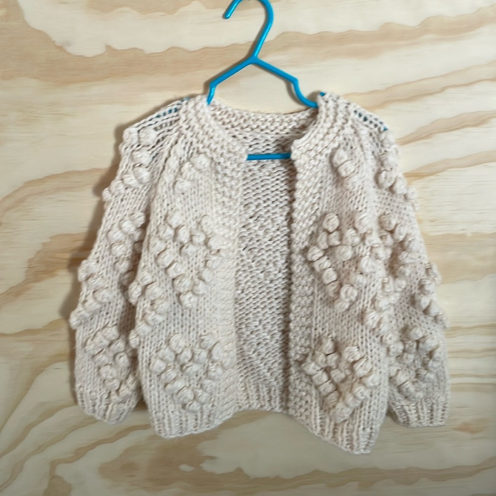 Chicwish 2T cardigan sweater with heart detail.